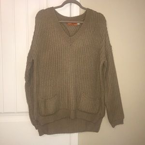 Beige criss cross back tunic sweater with pockets